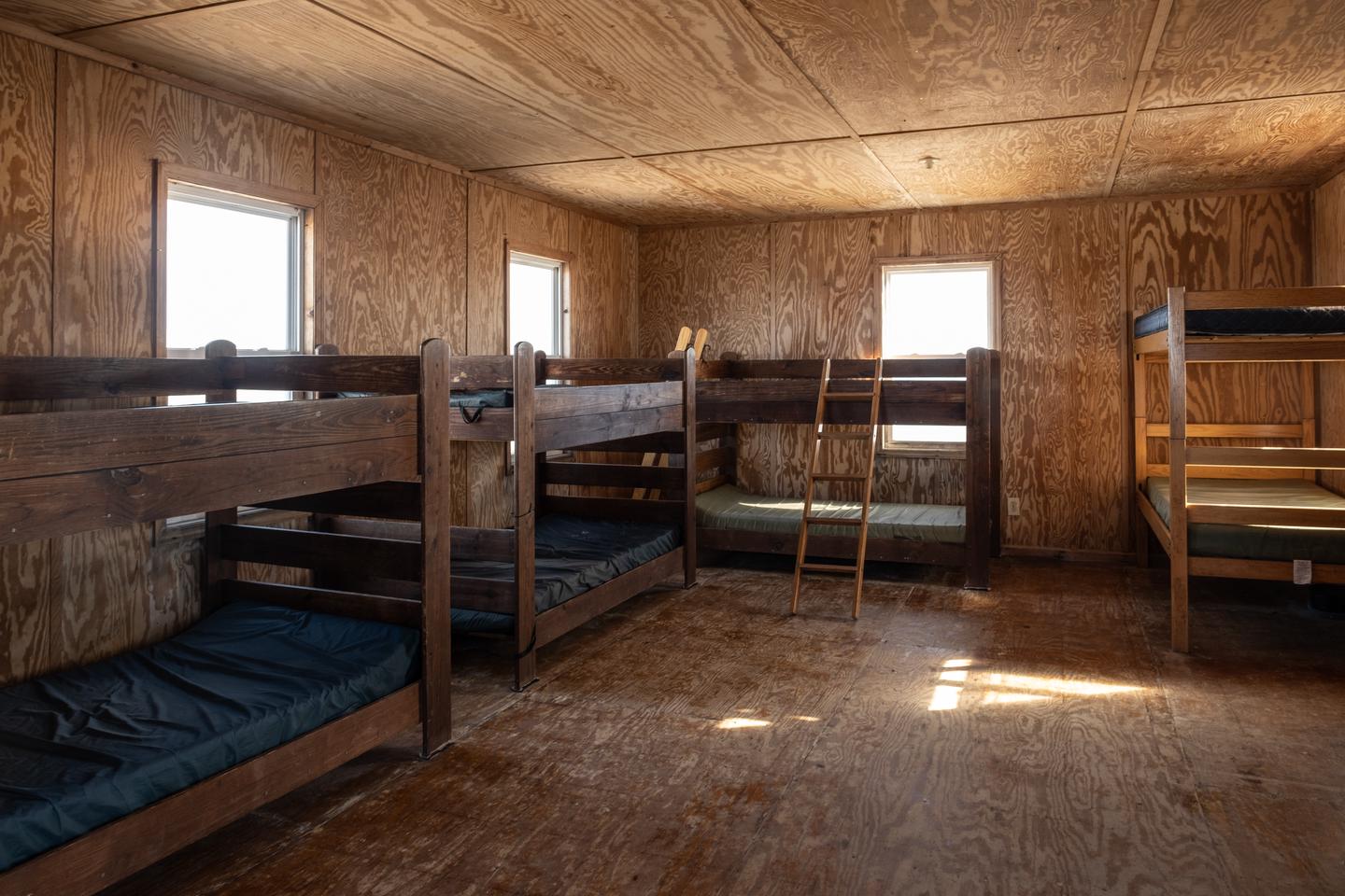 A view of the living room / bedroom area showing 4 bunk beds.Bedroom area with 4 bunk beds.