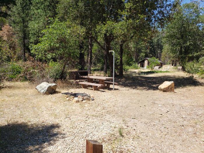 Spacious site featuring a picnic table. fire ring, lantern holder, and bear box.North Fork Site 18