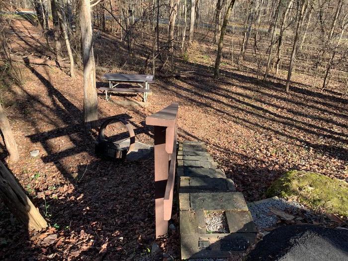 A stairway leading to the picnic table and circle fire ring.C-22 stairway to the picnic table and fire ring area.