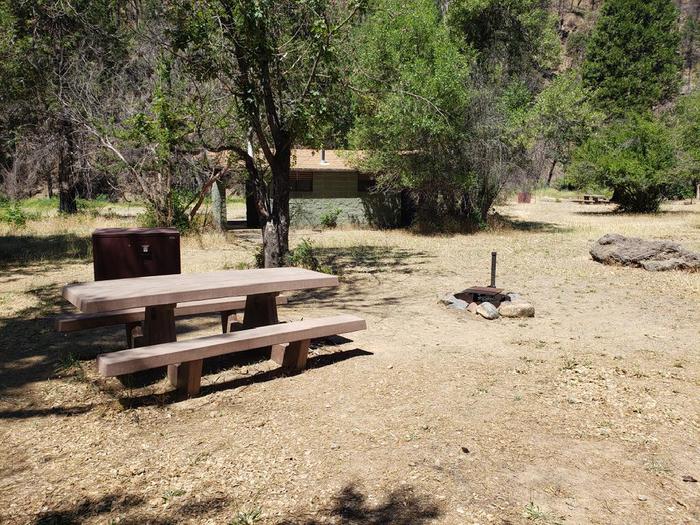 Spacious site featuring a picnic table, fire ring, and bear boxGansner Bar Site 4
