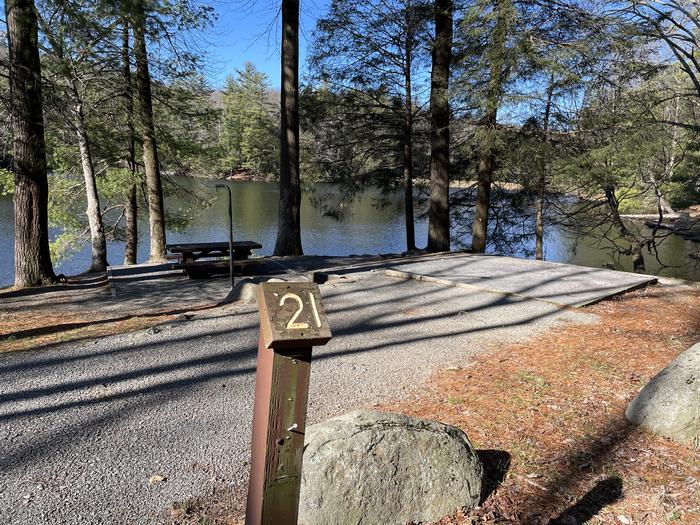 A photo of Site 21 of Loop Lower at Lake Conasauga Campground with Picnic Table, Fire Pit, Shade, Tent Pad, Waterfront, Lantern Pole