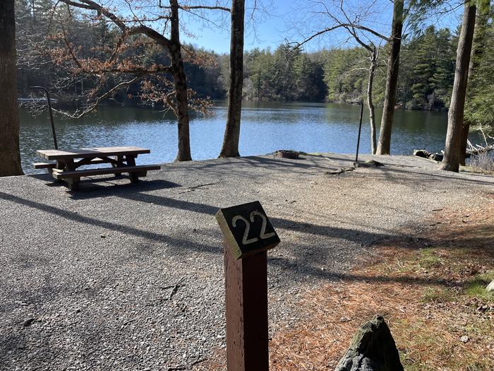 A photo of Site 22 of Loop Lower at Lake Conasauga Campground with Picnic Table, Fire Pit, Shade, Tent Pad, Waterfront, Lantern Pole