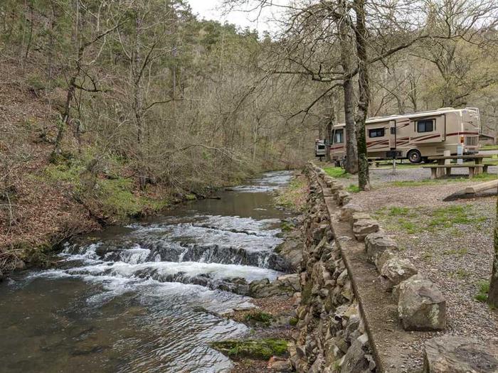 RV site by the creekSome sites are located along Gulpha Creek