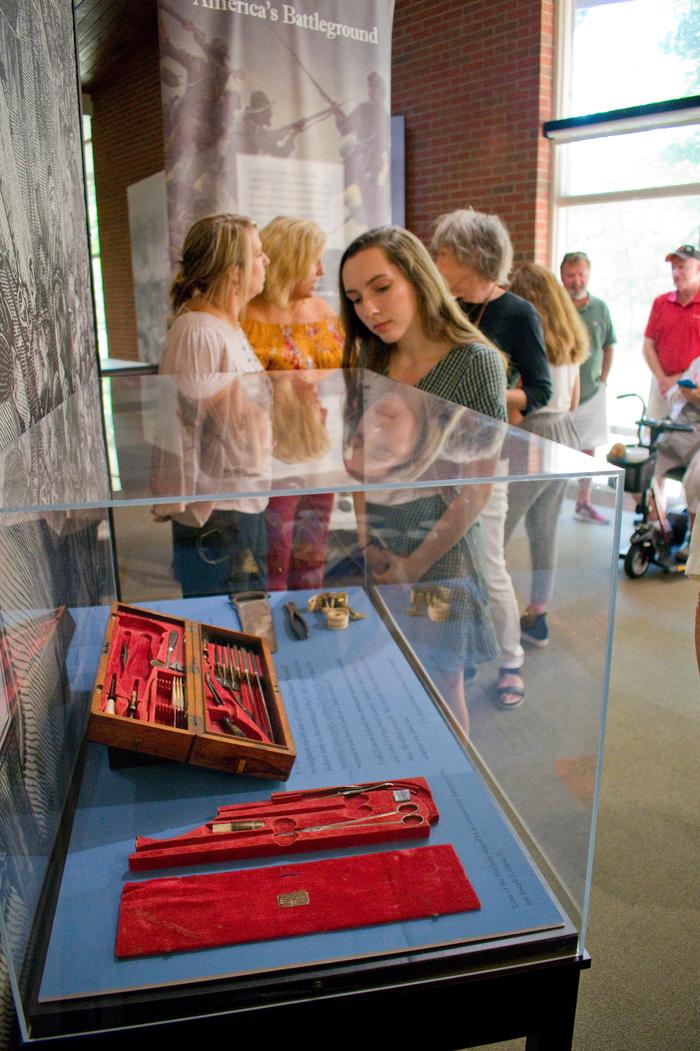 Visitor Looking at Exhibits at ChancellorsvilleExhibits at Chancellorsville include artifacts and stories from Chancellorsville, Wilderness, and Spotsylvania.