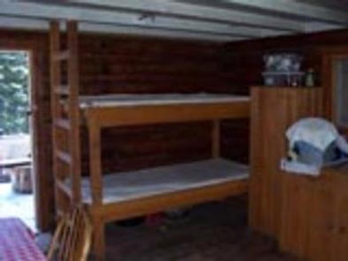 Interior of the cabin with bunkbedsInside the cabin