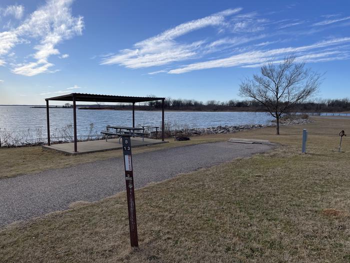 A photo of Site B13 of Loop B at LAKESIDE (OK) with Picnic Table, Electricity Hookup, Fire Pit, Waterfront, Water Hookup