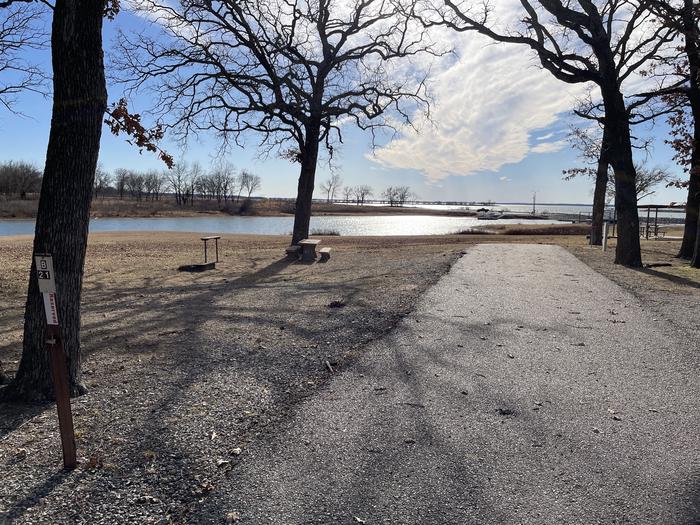 A photo of Site B21 of Loop B at LAKESIDE (OK) with Picnic Table, Electricity Hookup, Fire Pit, Shade, Waterfront, Water Hookup