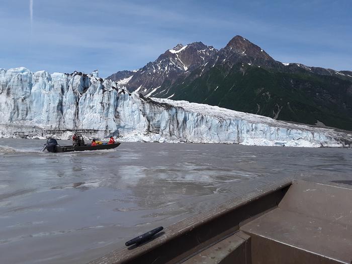 People in a boat in front of Childs GlacierBoating down the river.