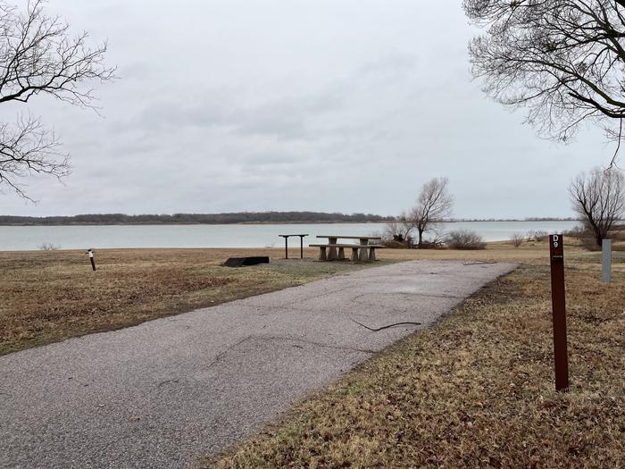 A photo of Site D09 of Loop D at LAKESIDE (OK) with Picnic Table, Electricity Hookup, Fire Pit, Waterfront, Water Hookup