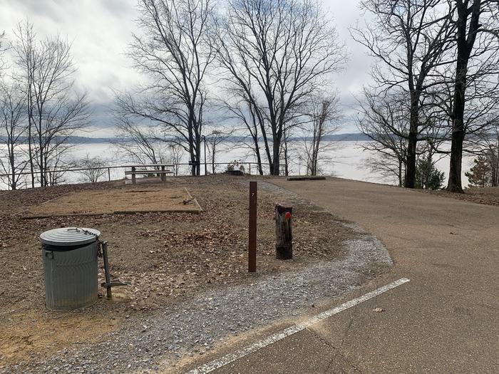 A photo of Site 7 of Loop Main Loop at Plum Point Campground with Picnic Table, Fire Pit, Tent Pad, Waterfront, Lantern Pole