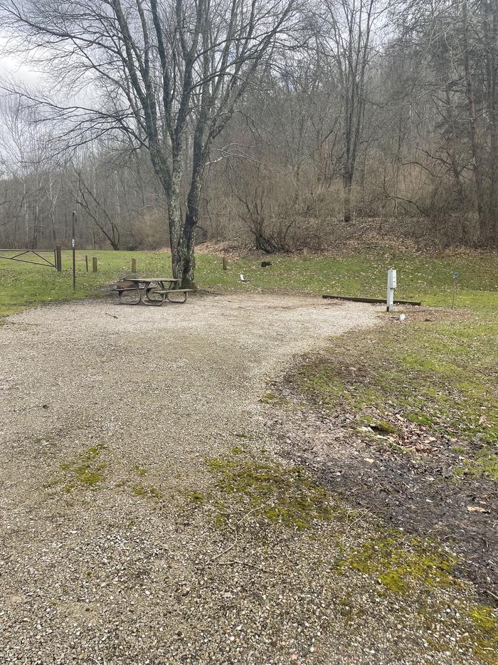 A photo of Site 027 of Loop  at Riffle Run Campground with Picnic Table, Fire Pit, Full Hookup, Lantern Pole