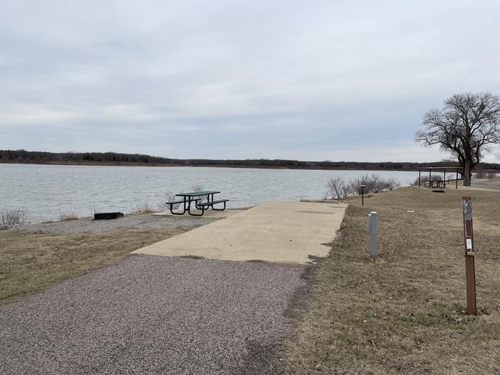 A photo of Site E24 of Loop E at LAKESIDE (OK) with Picnic Table, Electricity Hookup, Fire Pit, Waterfront, Water Hookup