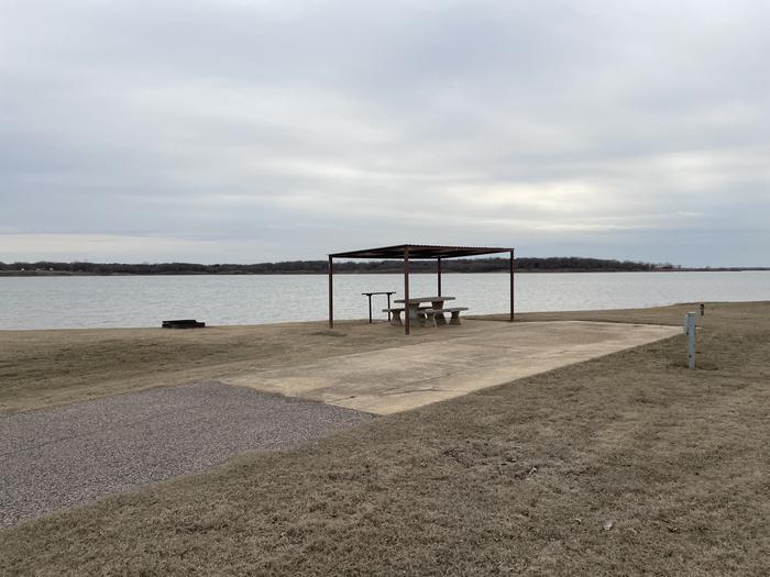 A photo of Site E11 of Loop E at LAKESIDE (OK) with Picnic Table, Electricity Hookup, Fire Pit, Waterfront, Water Hookup