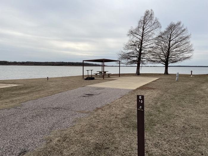 A photo of Site E10 of Loop E at LAKESIDE (OK) with Picnic Table, Electricity Hookup, Fire Pit, Waterfront, Water Hookup
