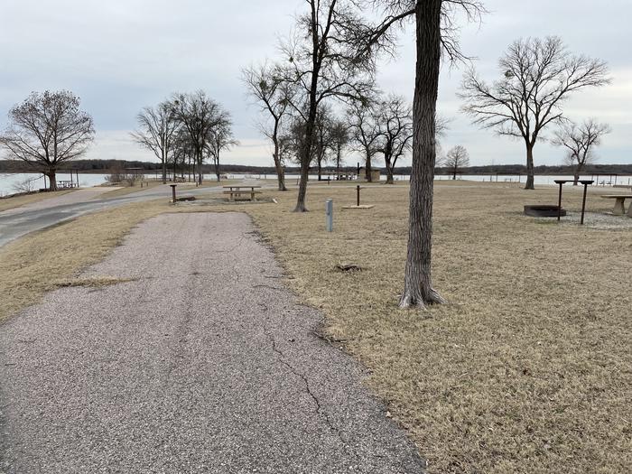 A photo of Site E20 of Loop E at LAKESIDE (OK) with Picnic Table, Electricity Hookup, Fire Pit, Waterfront, Water Hookup