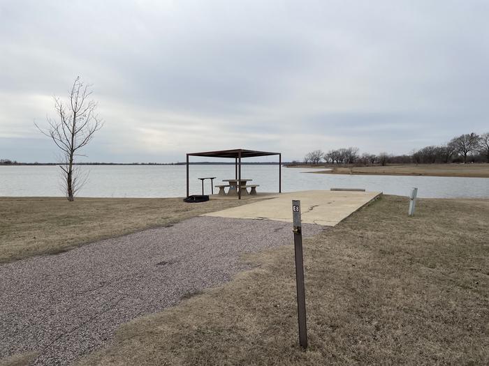 A photo of Site E08 of Loop E at LAKESIDE (OK) with Picnic Table, Electricity Hookup, Fire Pit, Waterfront, Water Hookup