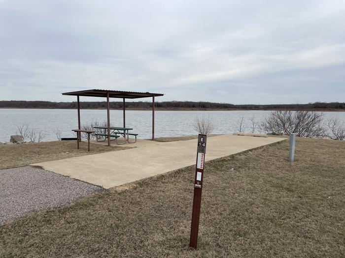 A photo of Site E14 of Loop E at LAKESIDE (OK) with Picnic Table, Electricity Hookup, Fire Pit, Waterfront, Water Hookup