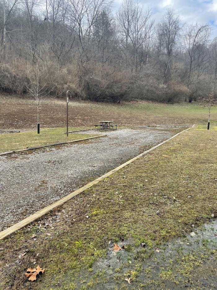 A photo of Site 058 of Loop  at Riffle Run Campground with Picnic Table, Fire Pit, Lantern Pole
