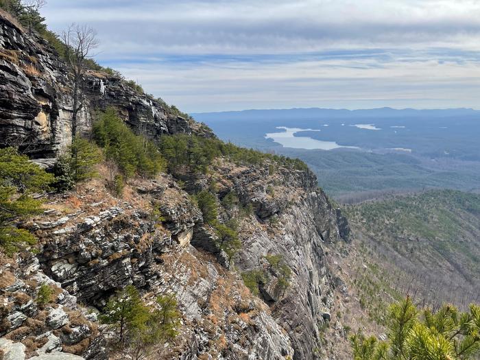 Rock cliff with lake in the background. View from Shortoff Mountain looking towards Lake James. 