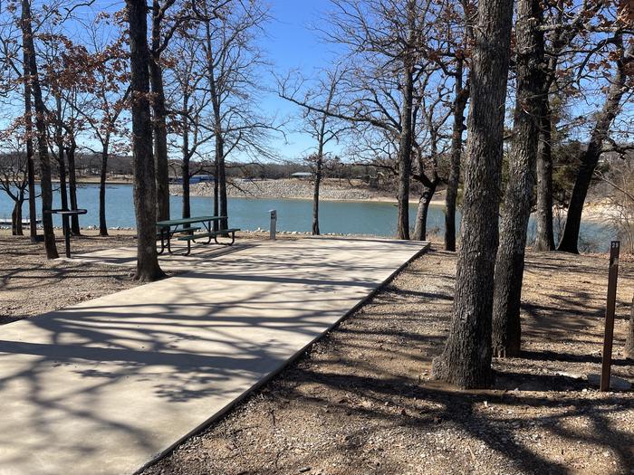 A photo of Site 29 of Loop PBEN at PRESTON BEND with Picnic Table, Electricity Hookup, Fire Pit, Shade, Waterfront, Water Hookup