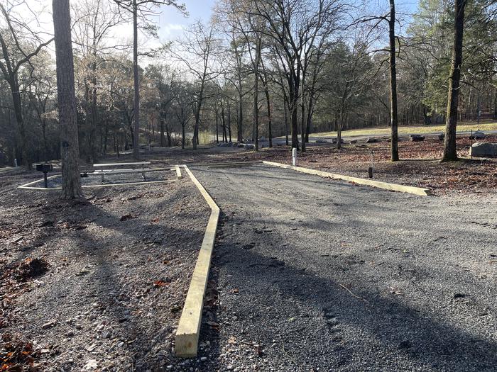 A photo of Site 03 of Loop A at Crystal Springs (AR) with Picnic Table, Electricity Hookup, Fire Pit, Water Hookup