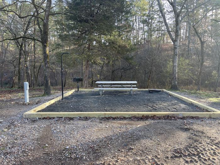A photo of Site 01 of Loop A at Crystal Springs (AR) with Picnic Table, Electricity Hookup, Fire Pit, Tent Pad, Lantern Pole