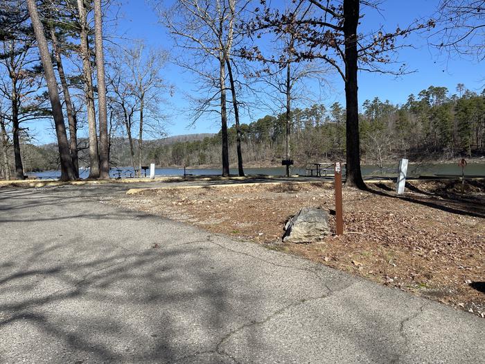 A photo of Site 15 of Loop A at Crystal Springs (AR) with Picnic Table, Electricity Hookup, Fire Pit, Water Hookup