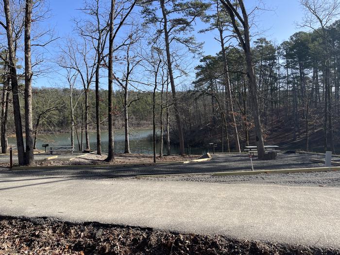 A photo of Site 07 of Loop A at Crystal Springs (AR) with Picnic Table, Electricity Hookup, Fire Pit, Water Hookup