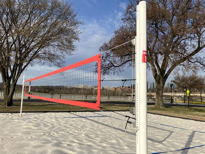 Close view of the volleyball court net and a sticker displaying the court number.