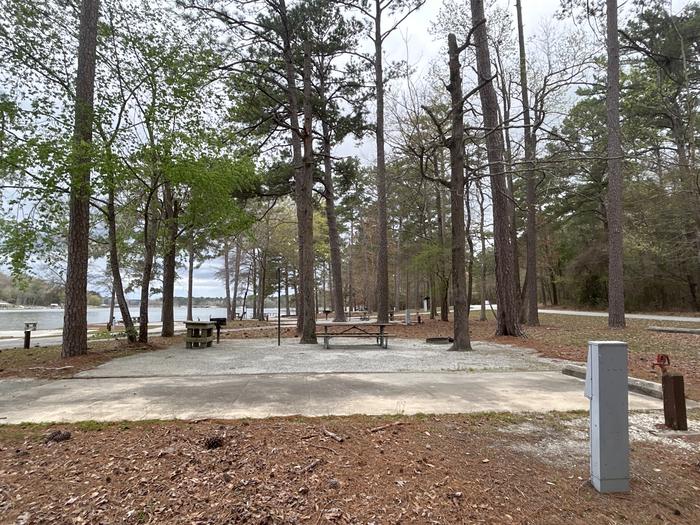 A photo of Site 076 of Loop CVIE at WHITE OAK (CREEK) CAMPGROUND with Picnic Table, Electricity Hookup, Fire Pit, Shade, Lantern Pole, Water Hookup