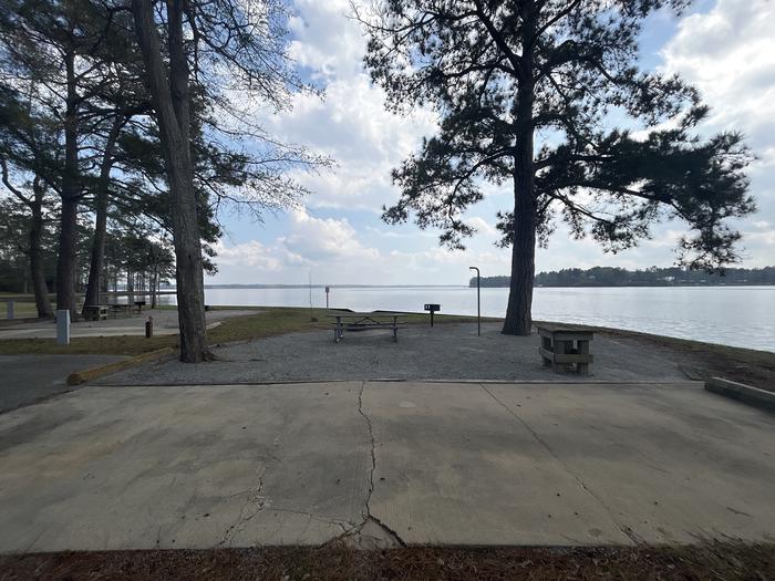 A photo of Site 091 of Loop CVIE at WHITE OAK (CREEK) CAMPGROUND with Picnic Table, Electricity Hookup, Fire Pit, Shade, Tent Pad, Waterfront, Lantern Pole, Water Hookup