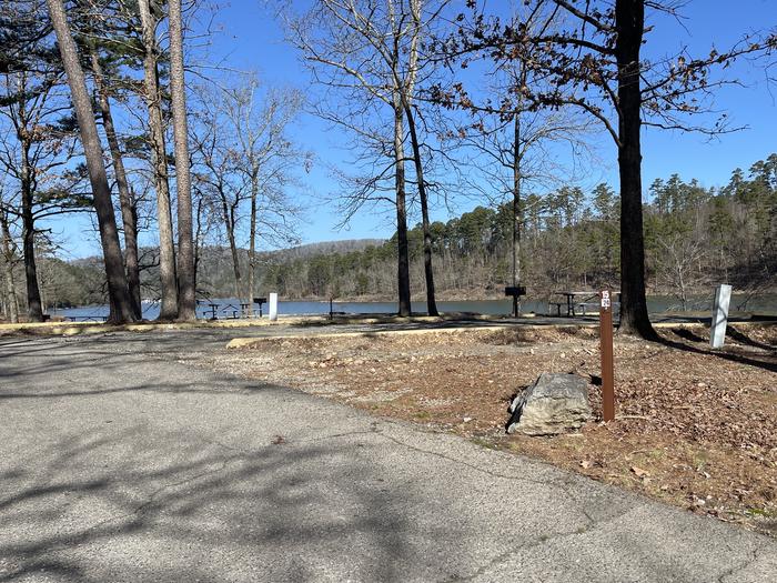 A photo of Site 15 of Loop A at Crystal Springs (AR) with Picnic Table, Electricity Hookup, Fire Pit, Water Hookup