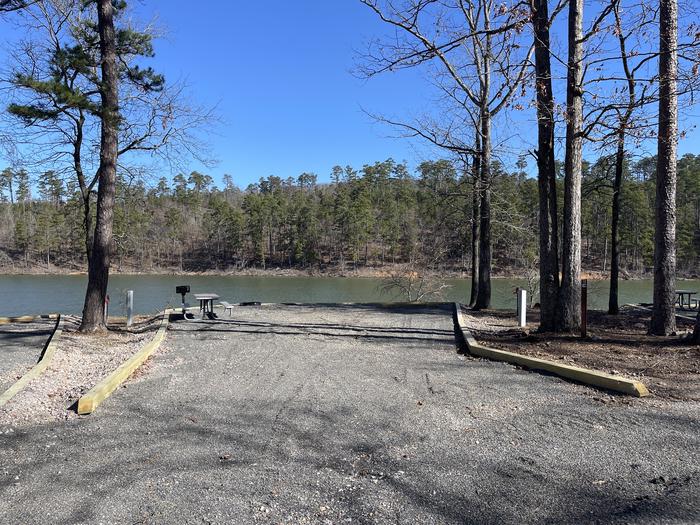 A photo of Site 16 of Loop A at Crystal Springs (AR) with Picnic Table, Electricity Hookup, Fire Pit, Water Hookup