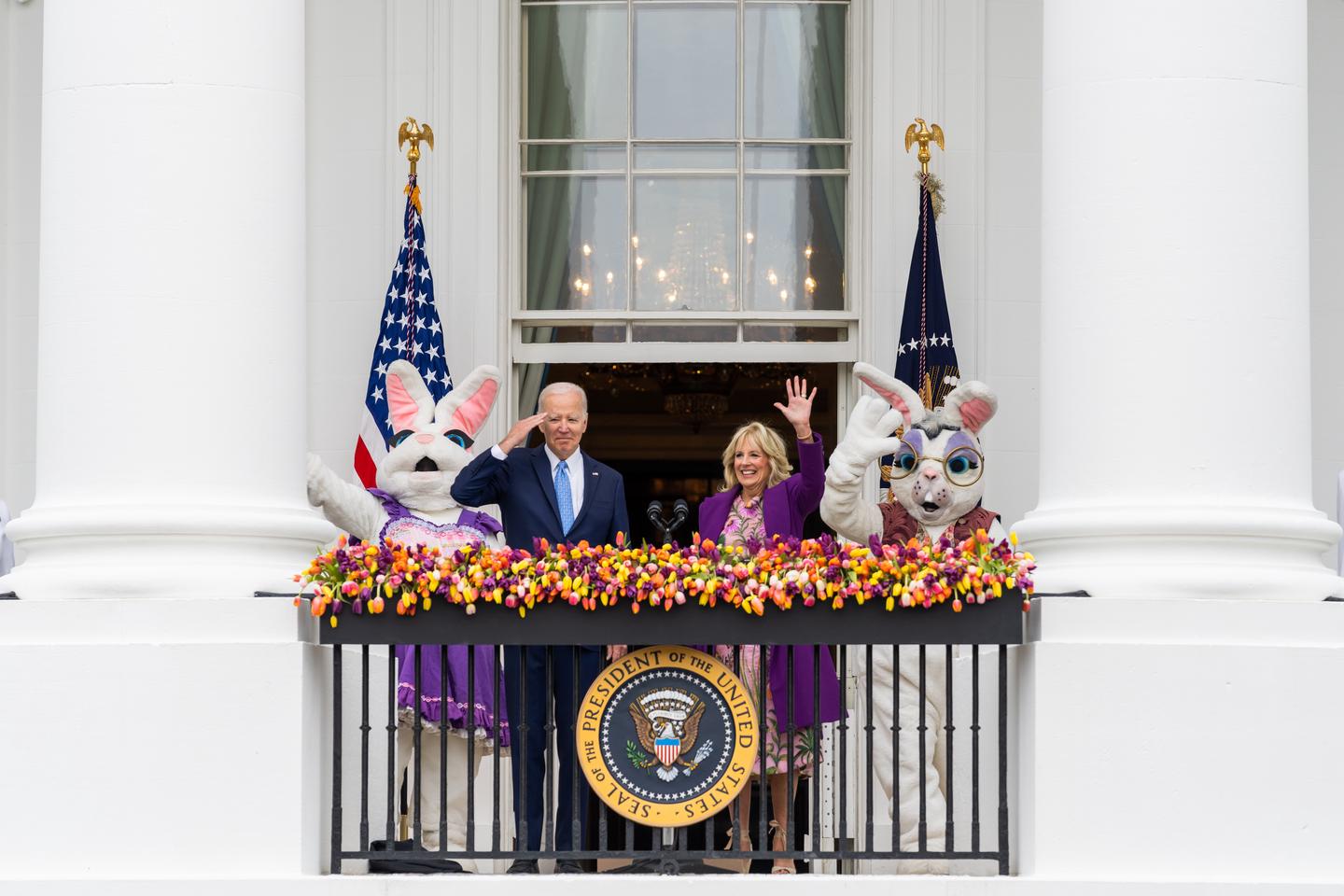 The President and First Lady with Easter Bunnies waving to visitors at the White House Easter Egg Roll