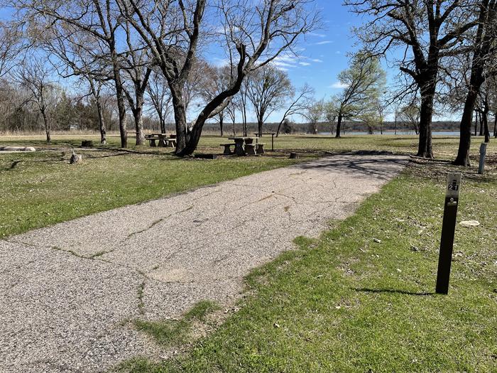 A photo of Site F21 of Loop F at LAKESIDE (OK) with Picnic Table, Electricity Hookup, Fire Pit, Shade, Water Hookup