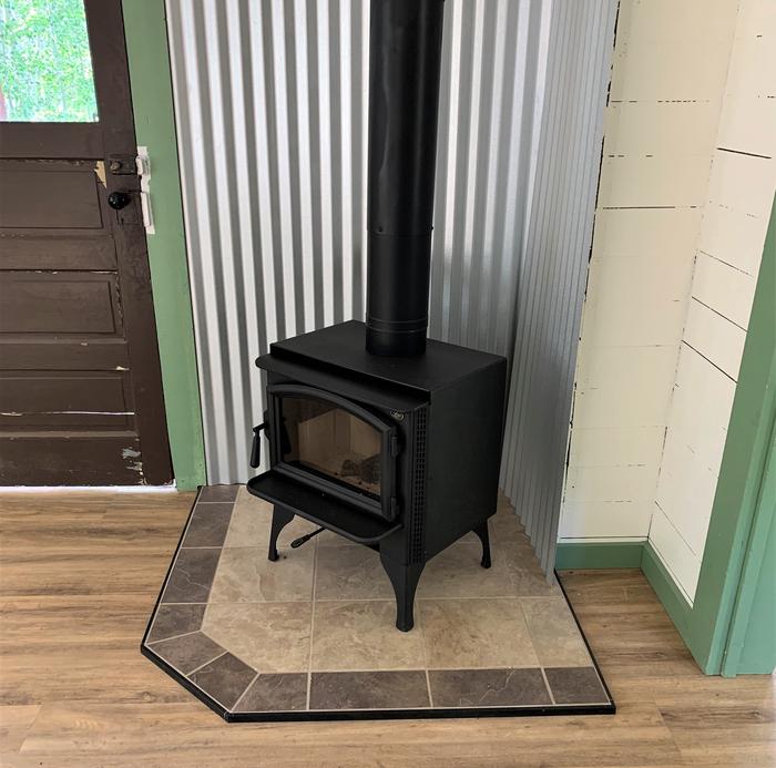 Wood burning stove near the front door, inside the guard stationA new wood burning stove installed in 2022