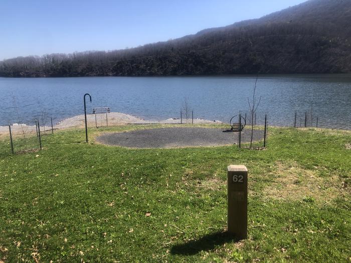 A photo of Site 62 - near water of Loop SUSQUEHANNOCK  at SUSQUEHANNOCK with Picnic Table, Fire Pit, Tent Pad, Waterfront, Lantern Pole
