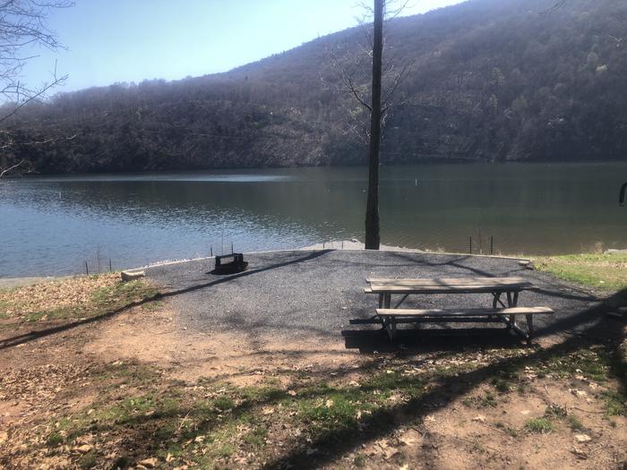 A photo of Site 58-near water of Loop SUSQUEHANNOCK  at SUSQUEHANNOCK with Picnic Table, Fire Pit, Tent Pad, Waterfront, Lantern Pole