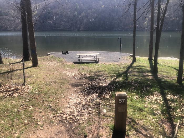 A photo of Site 57 - near water of Loop SUSQUEHANNOCK  at SUSQUEHANNOCK with Picnic Table, Fire Pit, Tent Pad, Waterfront, Lantern Pole