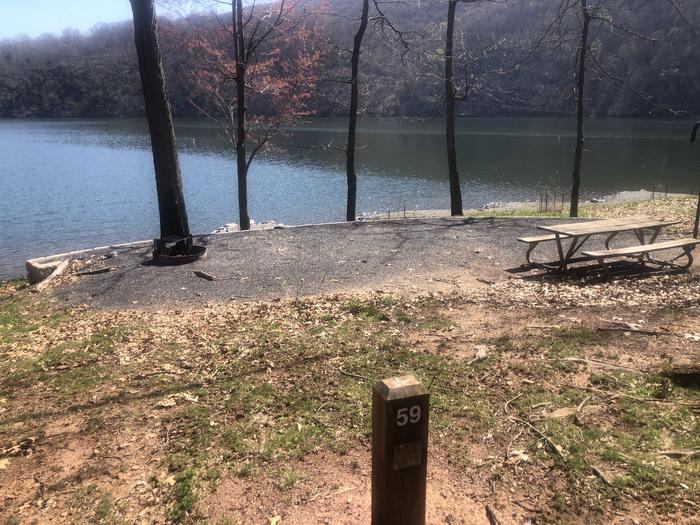 A photo of Site 59 - near water of Loop SUSQUEHANNOCK  at SUSQUEHANNOCK with Picnic Table, Fire Pit, Tent Pad, Waterfront, Lantern Pole