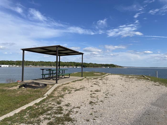A photo of Site A29 of Loop A at CANEY CREEK with Picnic Table, Electricity Hookup, Fire Pit, Waterfront, Water Hookup