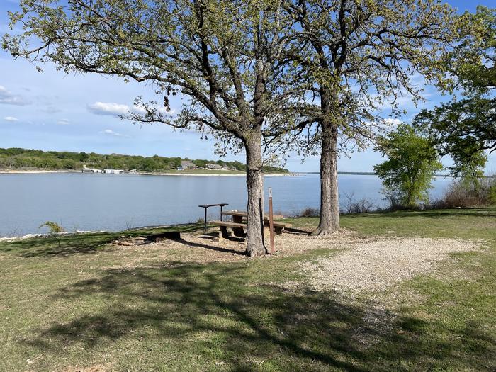 A photo of Site B06 of Loop B at CANEY CREEK with Picnic Table, Fire Pit, Shade, Waterfront, Water HookupA photo of Site B06 of Loop B at CANEY CREEK with Picnic Table, Fire Pit, Shade, Waterfront, Water