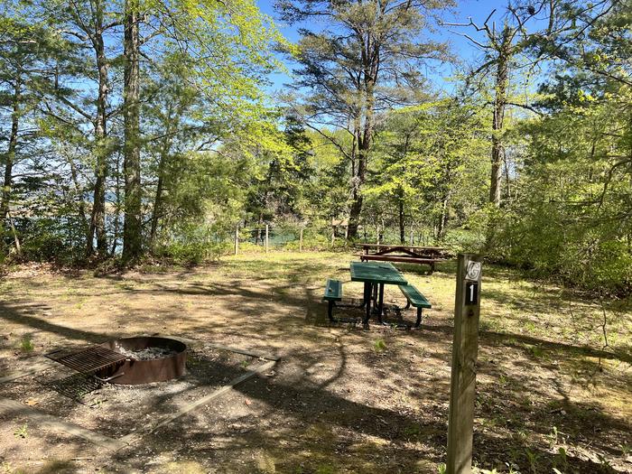 A photo of Site G1 of Loop Paradise Grove at Pax River Paradise Grove Campgrounds with Picnic Table, Waterfront
