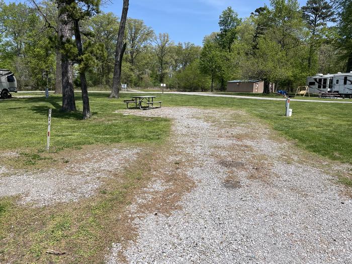 A photo of Site E-3 of Loop E at Crab Orchard Campground with Picnic Table, Electricity Hookup, Fire Pit, Water Hookup