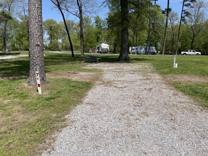A photo of Site E-7 of Loop E at Crab Orchard Campground with Picnic Table, Electricity Hookup, Fire Pit, Water Hookup
