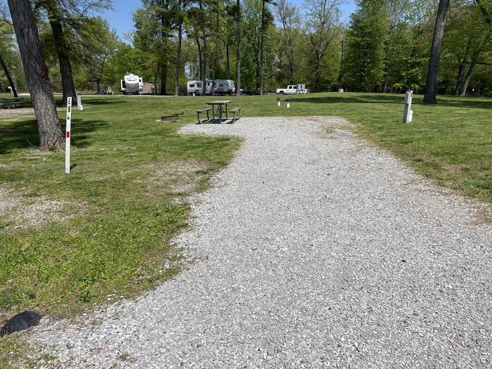 A photo of Site E-9 of Loop E at Crab Orchard Campground with Picnic Table, Electricity Hookup, Fire Pit, Water Hookup