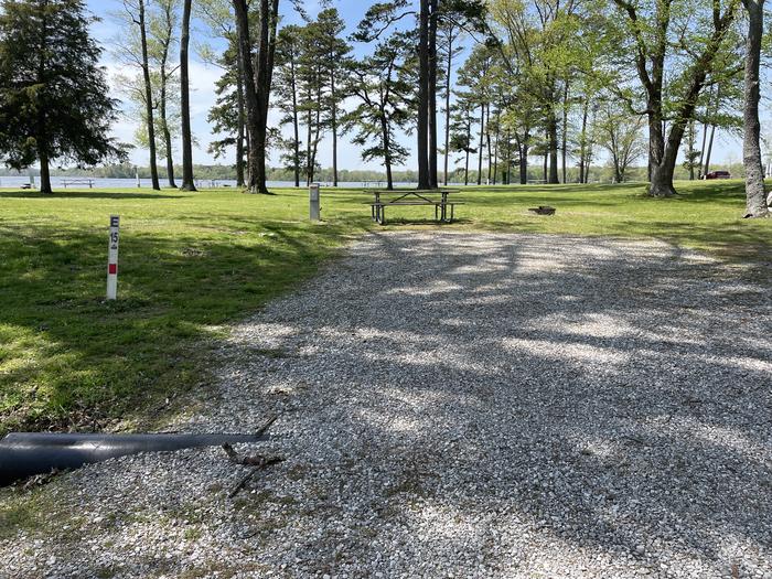 A photo of Site E-15 of Loop E at Crab Orchard Campground with Picnic Table, Electricity Hookup, Fire Pit, Shade, Water Hookup
