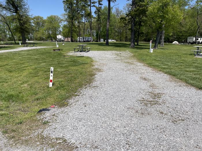 A photo of Site E-10 of Loop E at Crab Orchard Campground with Picnic Table, Electricity Hookup, Fire Pit, Water Hookup