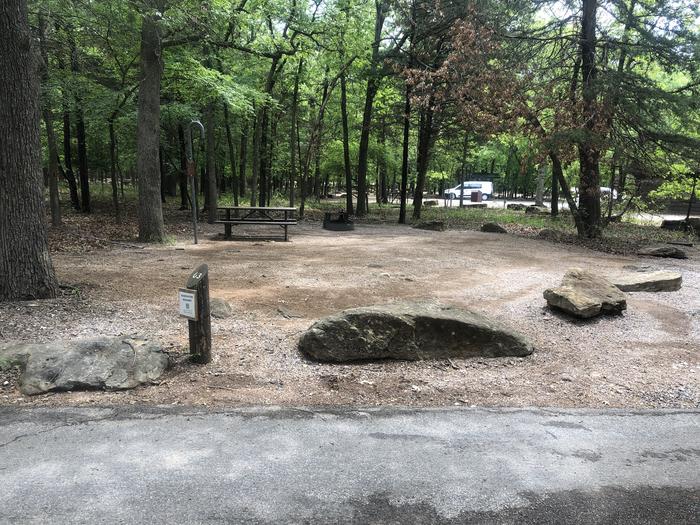 A photo of Site 63 of Loop Cold Springs at Cold Springs Campground (OK) Chickasaw NRA with Picnic Table, Fire Pit, Lantern Pole