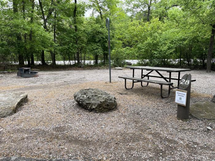 A photo of Site 28 at Cold Springs Campground (OK) Chickasaw NRA with Picnic Table, Fire Pit, Lantern Pole